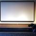 A worker touches up a stair in front of a large projection screen in the multipurpose room at Barracuda Networks. Melanie Maxwell I AnnArbor.com
